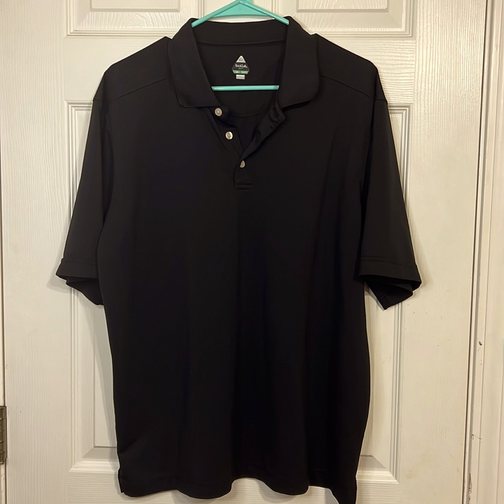 Black golf shirt.